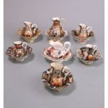 Seven Derby porcelain toy jug and basin sets: each decorated variously in the Witches and Imari