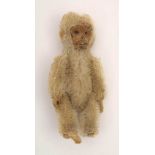 A Schuco white plush monkey brooch:, signed to pin as per title, 8.