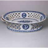 A Chinese Export blue and white two-handled pierced basket: painted with a tree peony, butterflies,