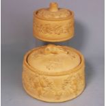 Two Wedgwood cane ware pie dishes and covers: of circular form the larger dish moulded with hung