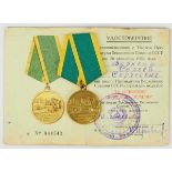2.2.) Welt Sowjetunion: Medaille für die Erschließung von Neuland, mit Verleihungsbuch.Messing