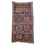 Persian-Kurdish-rug around 1900, ghiordes-knot, slightly worn, with small damages, 275*146 cm