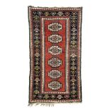 Caucasian-Kazak-rug around 1900, ghiordes-knot, slightly worn, incomplete at the ends, moth-eaten,