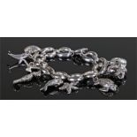 Silver marine charm bracelet, the chain with attached marine charms including shells, dolphin,