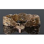 9 carat gold padlock bracelet, the padlock clasp with mesh and curved bar links, 23.9 grams