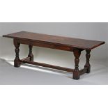 17th Century style dining table, the long plank top above turned legs and H stretcher, 230cm x