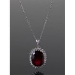 Diamond and Rubelite nekclace and pendant, the oval Rubelite surrounded by diamonds, with a