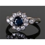 18 carat gold diamond and sapphire ring, the central sapphire surrounded with twelve diamonds,