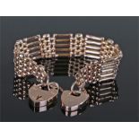 9 carat gold padlock bracelet, the gate links with two padlock clasps, 20.6 grams