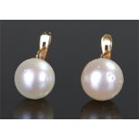 Pair of 18 carat gold and pearl earrings, with a single pearl to each earring