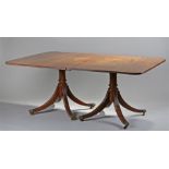 Regency and later twin pillar dining table, the rectangular top with two additional leaves,