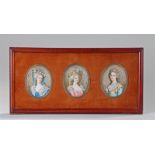 Set of three early 20th Century miniatures, each depicting a lady, oil on ivory, framed together