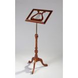 Music stand, with lyre shaped support and adjustable column, raised on cabriole legs, stand 45.5cm