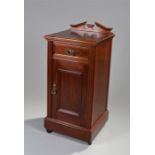 Edwardian bedside cabinet, the rectangular top above a frieze drawer and cupboard door, raised on