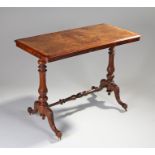 Victorian walnut centre table, the rectangular top with bow wood stringing, above turned supports