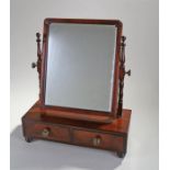 Victorian mahogany toilet mirror, the rectangular mirror plate held with two supports, two drawers