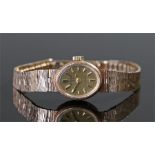 Rotary 9 carat gold ladies wristwatch, the oval signed dial with baton hours, bark effect 9 carat