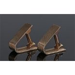 Pair of 9 carat gold cufflinks, the hinged rectangular engine turned bands with clip rod, 12.4