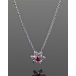 Ruby and diamond set white metal pendant necklace. The central ruby with diamond leaf mount, 13mm