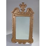 19th Century giltwood wall mirror, the scroll finial above C scrolls carved foliate applied apron,