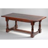 17th Century style oak refectory table, the plank top above turned legs and H frame stretcher, 183cm