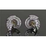 Pair of white metal diamond set earrings, diamond set sweeping scroll design, 17mm diameter, cased