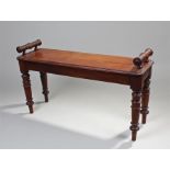 Victorian mahogany window seat, with turned columns to each end above a solid seat with moulded