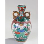 19th Century Kutani Vase, decorated in polychrome colours, a pagoda on a riverside with trees, 14.