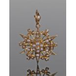 Victorian 15 carat gold pearl set pendant brooch of star design, with clover leaf edge, 25mm