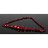 Large Art Deco Cherry Bakelite amber necklace, with graduating beads, the largest 27mm long, total