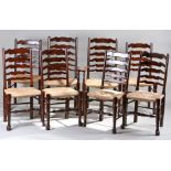 Set of eight 18th Century style ladder back chairs, the arched slat backs above rush seats and