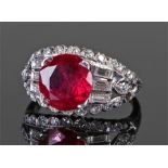 Platinum ruby and diamond ring, the central 3.72 carat ruby flanked by baguette and round cut