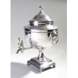 19th Century silver plated samovar, the ball finial above a lidded urn, a pair of carrying