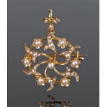 15 carat gold and pearl set pendant brooch, in the form of flowers and swirl leaves, with pendant