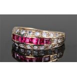 18 carat gold diamond and ruby set ring, with a row of eight emerald cut rubies, two rows of