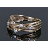 9 carat gold diamond set ring, with five diamonds two a triple band, ring size P