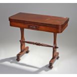 Victorian mahogany games table, the rectangular top with rounded corners above shaped supports and