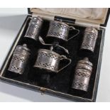 George V silver set, Birmingham 1929 the cased set with two mustards, two salts and two peppers