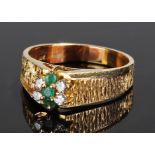 14 carat gold diamond and emerald set ring, with a central row of three emeralds, flanked by four