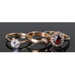 Three 9 carat gold rings, to include a wedding band and two stone sets rings, (3)