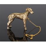 9 carat gold dog brooch, the brooch in the form of a standing dog, 38mm long, 17.5 grams