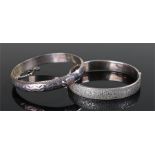 Two silver bracelets, one with bark design the other with geometric design, (2)