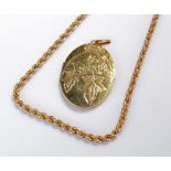 9 carat gold necklace, rope twist design, 5.7 grams, together with a rolled gold locket, (2)