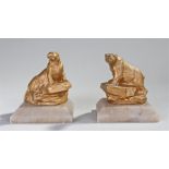 Pair of early 20th Century walrus and polar bear ornaments, the gilt metal figures on rocky plinths,