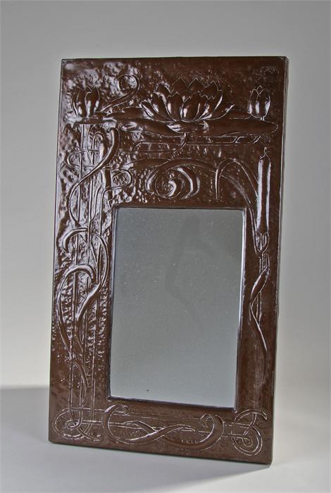 Arts & Crafts style copper framed mirror, possibly Scottish, decorated with bull rushes and water