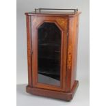 Victorian walnut and inlaid pier cabinet, the brass gallery top above satinwood inlaid swags and