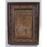 Framed brass plaque, with a court scene, 41cm high