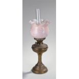 Victorian oil lamp, the copper base with reeded column, pink glass shade and glass chimney, 57cm