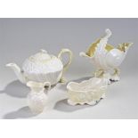 Four pieces of Belleek, to include a conch shell,