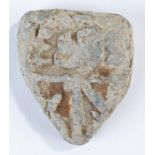 Rare large medieval weight, the shield shape decorated with initials and a burst, 75mm high